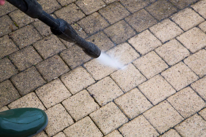 Outdoor floor cleaning with high pressure water jet